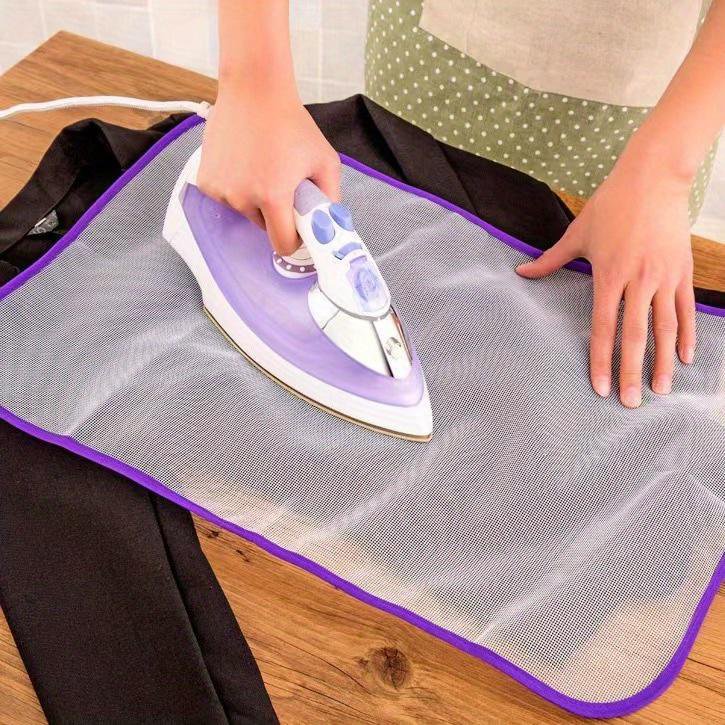 Garment steaming with heat insulated ironing board