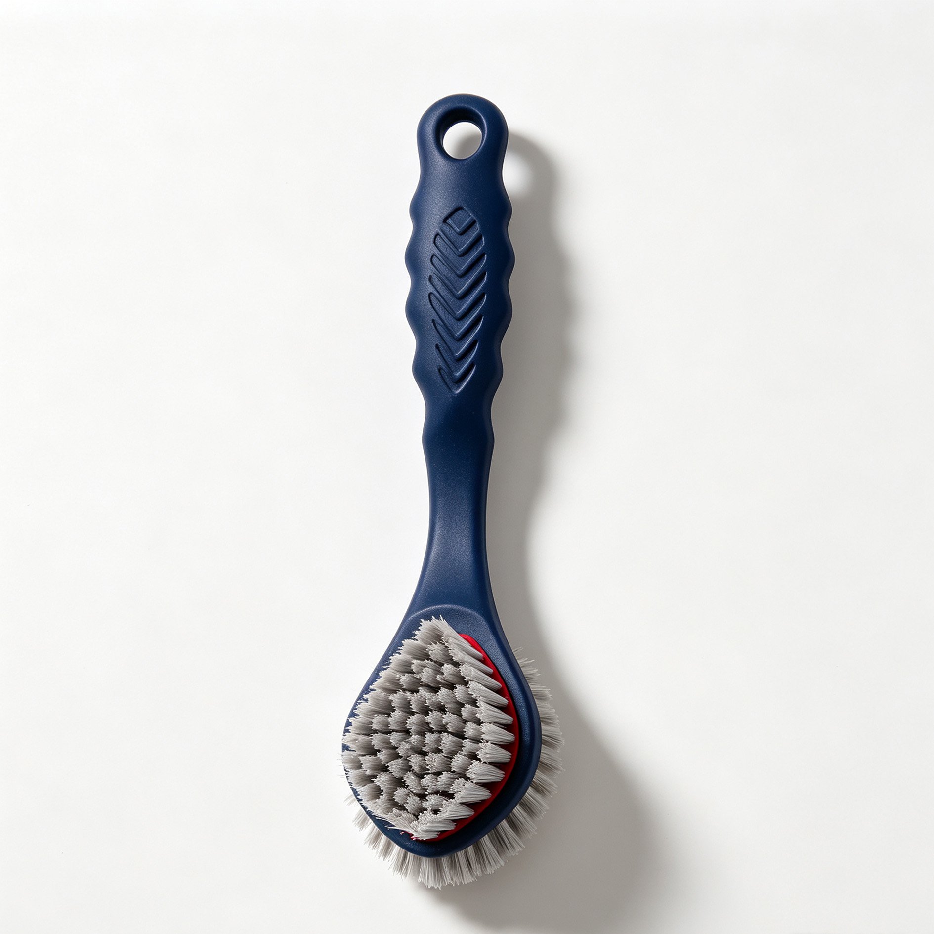 Dual-sided cleaning brush used on kitchen sink