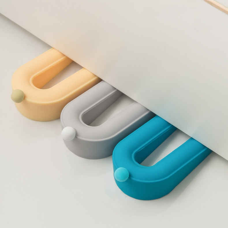 Tope de puerta en forma de dona, portátil y fácil de almacenar