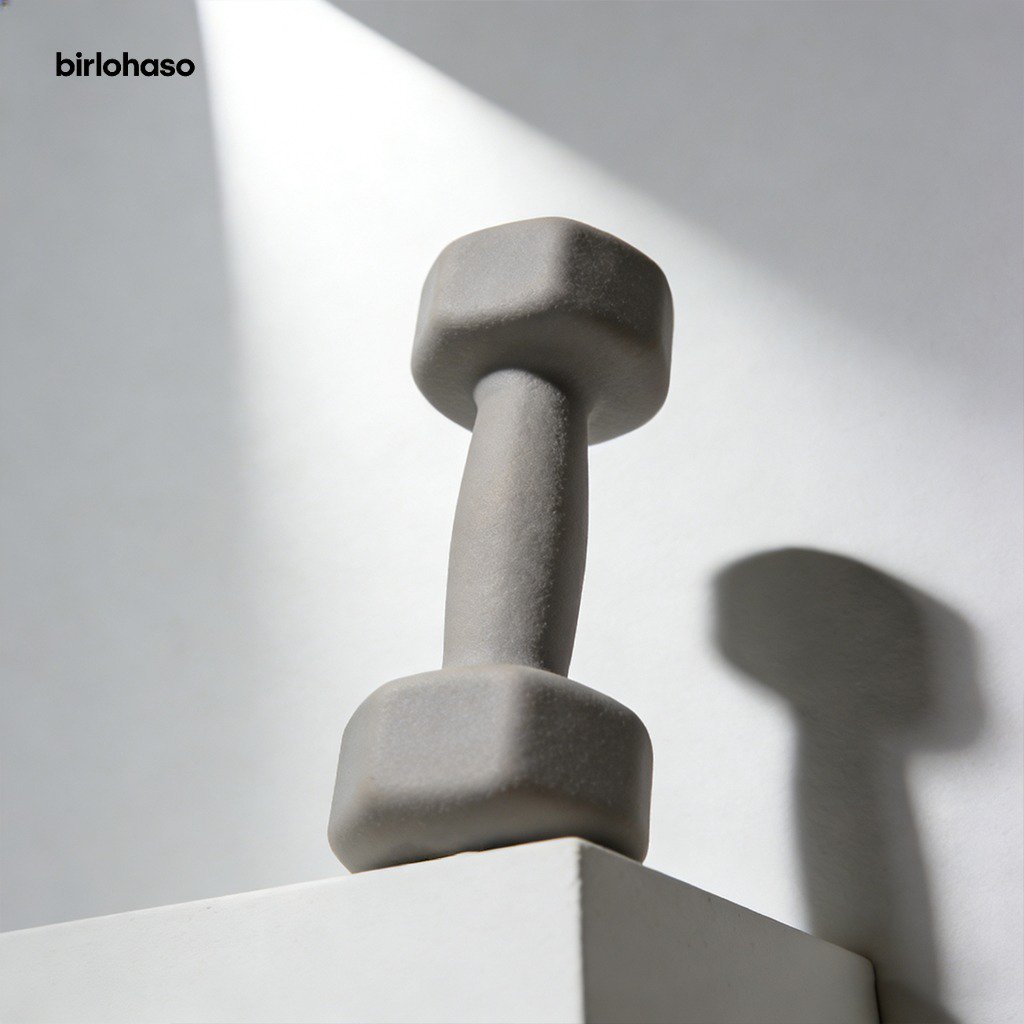 Close-up of 5 reps dumbbells on gym floor