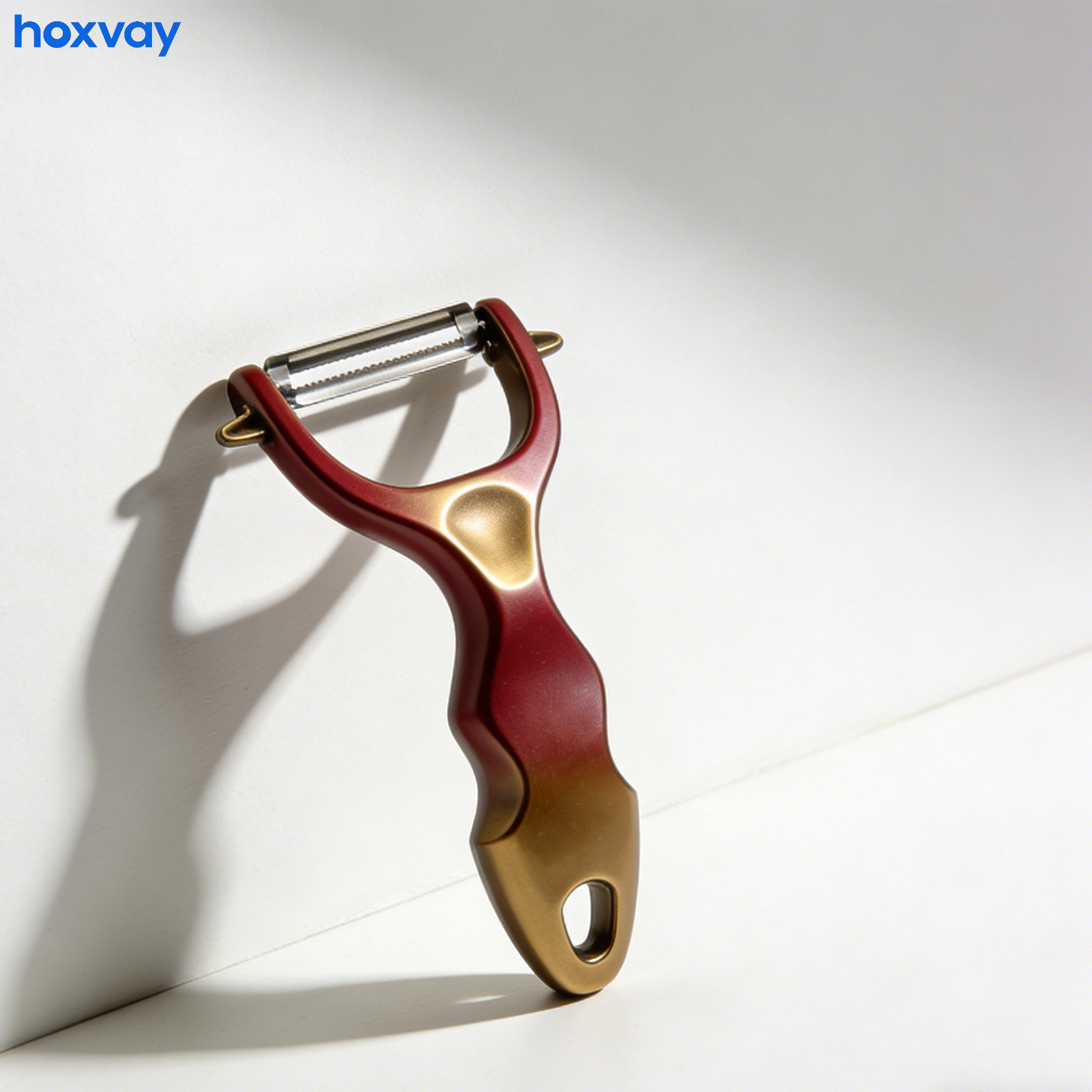 Hand using vegetable peeler to peel carrot