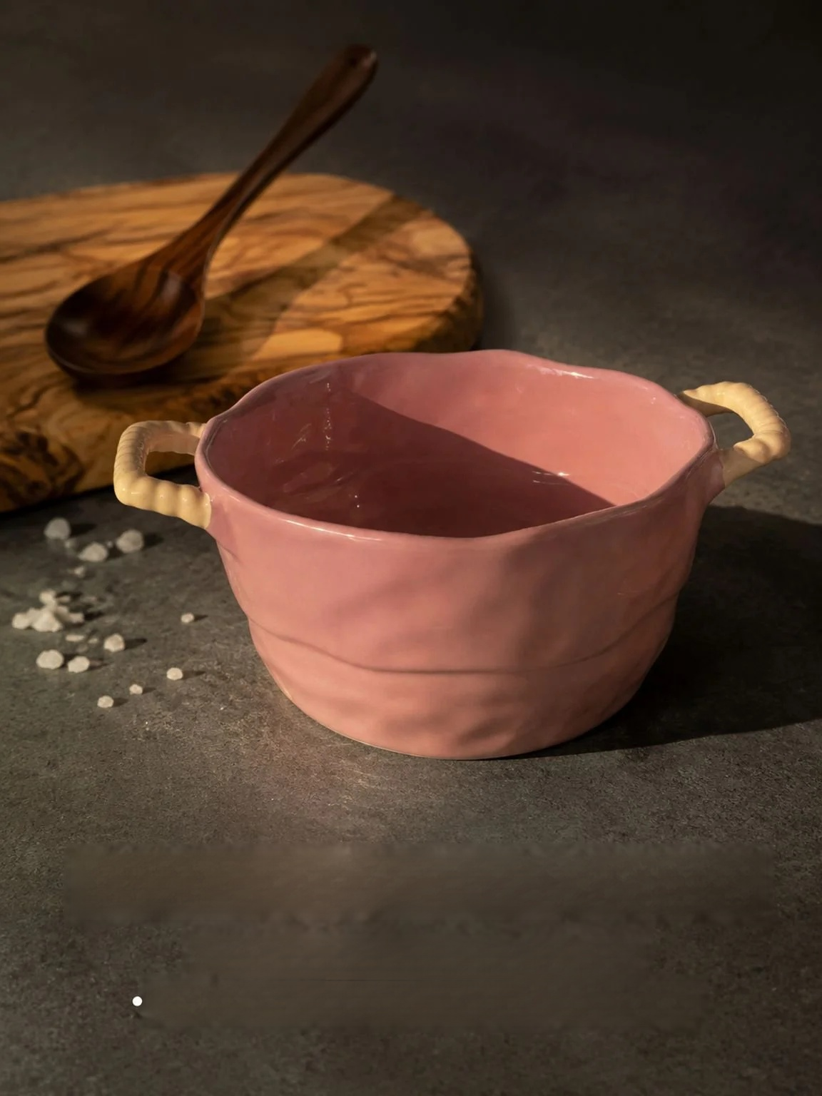 Side view of a ceramic soup bowl with sturdy handles