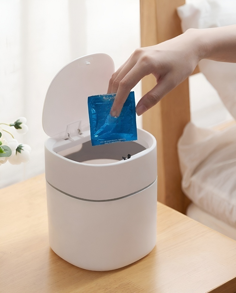Odor-resistant flip-top trash can for bathroom use