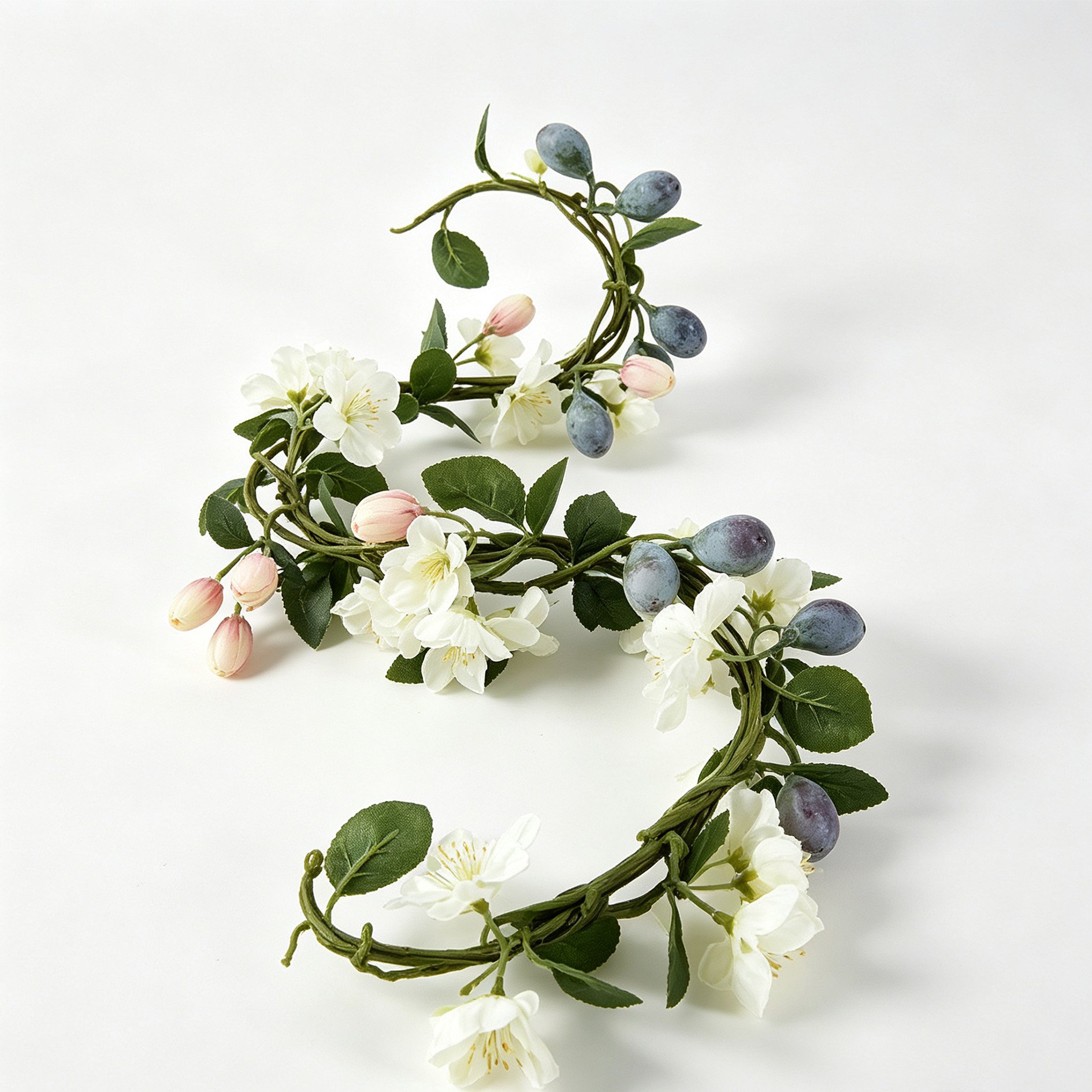 Close-up of lush green leaves and fruit accents