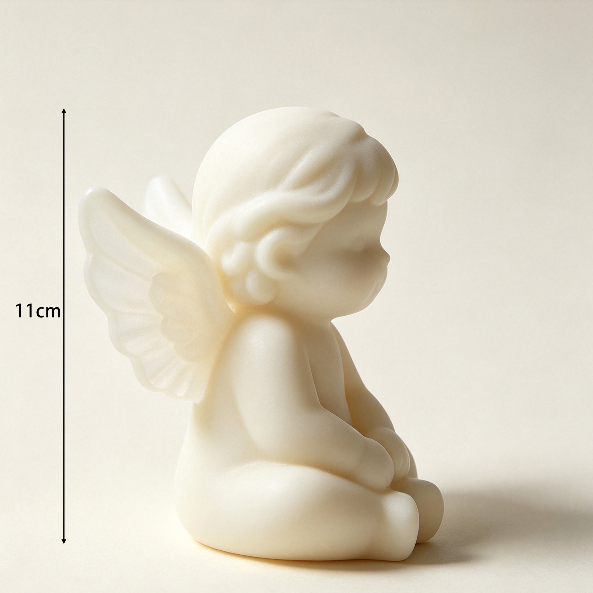 Close-up of detailed angel wings on ceramic ornament