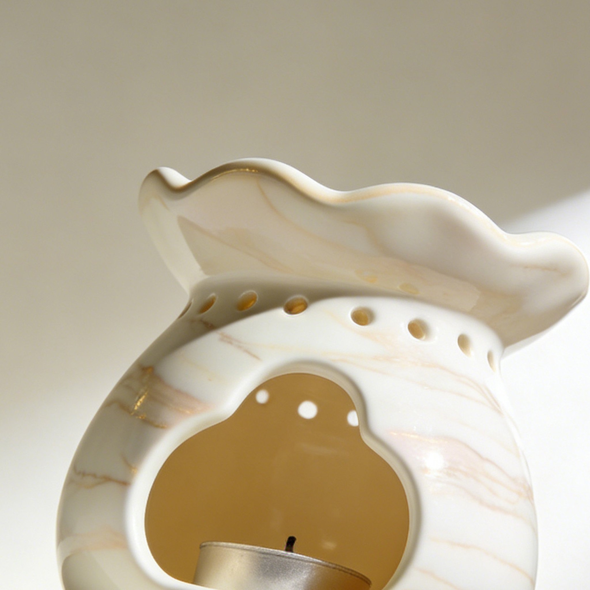 Elegant ceramic aromatherapy burner on a wooden table
