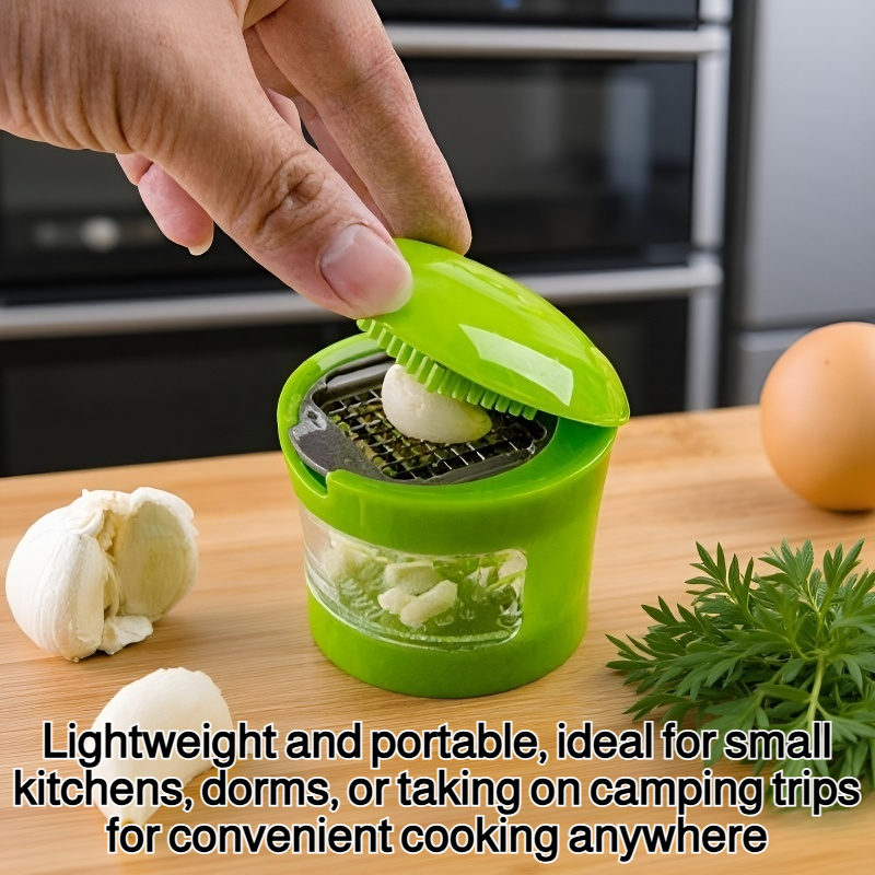 Compact garlic crusher with ergonomic handle