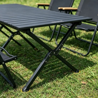 Complete outdoor camping table and chair set arranged at a campsite