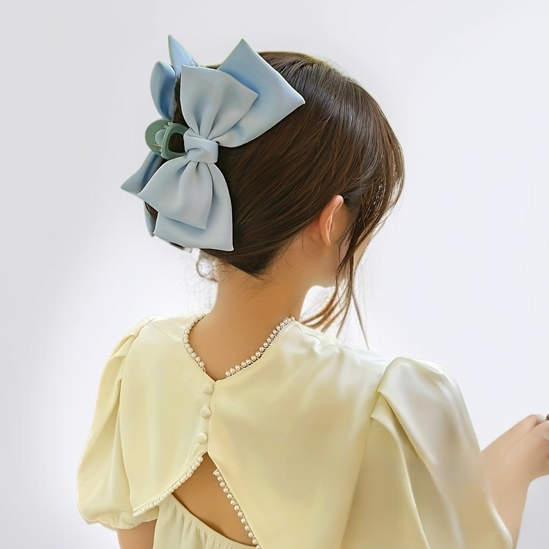 Arc-shaped claw clip