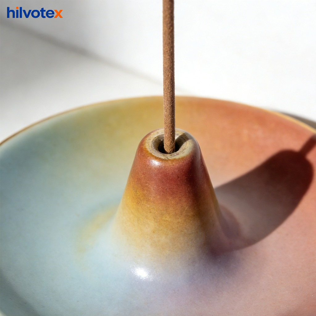 Elegant ceramic decorative incense holder on wooden table
