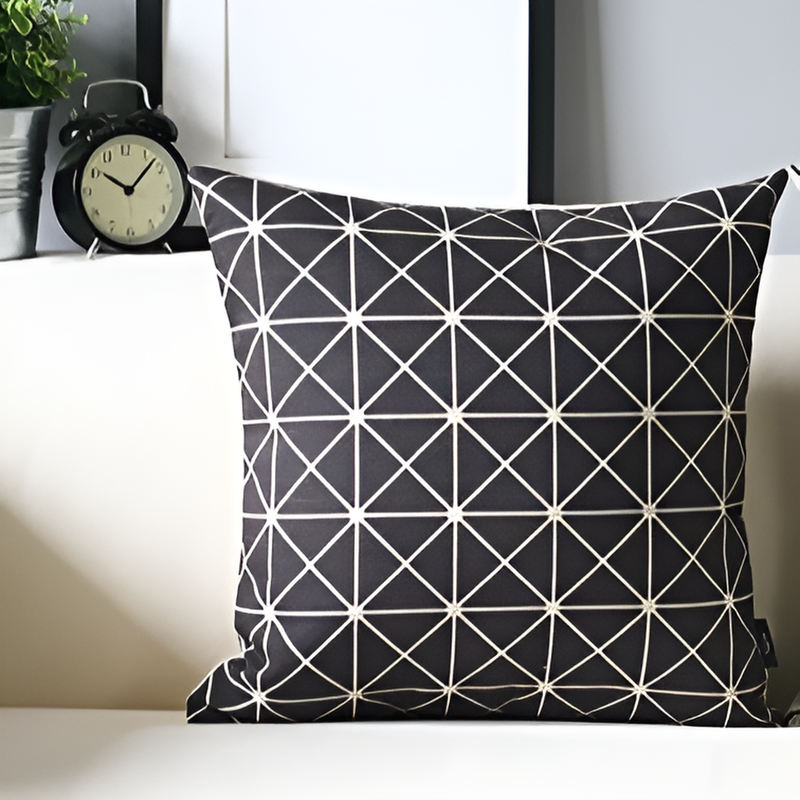 Geometric black and white cushion