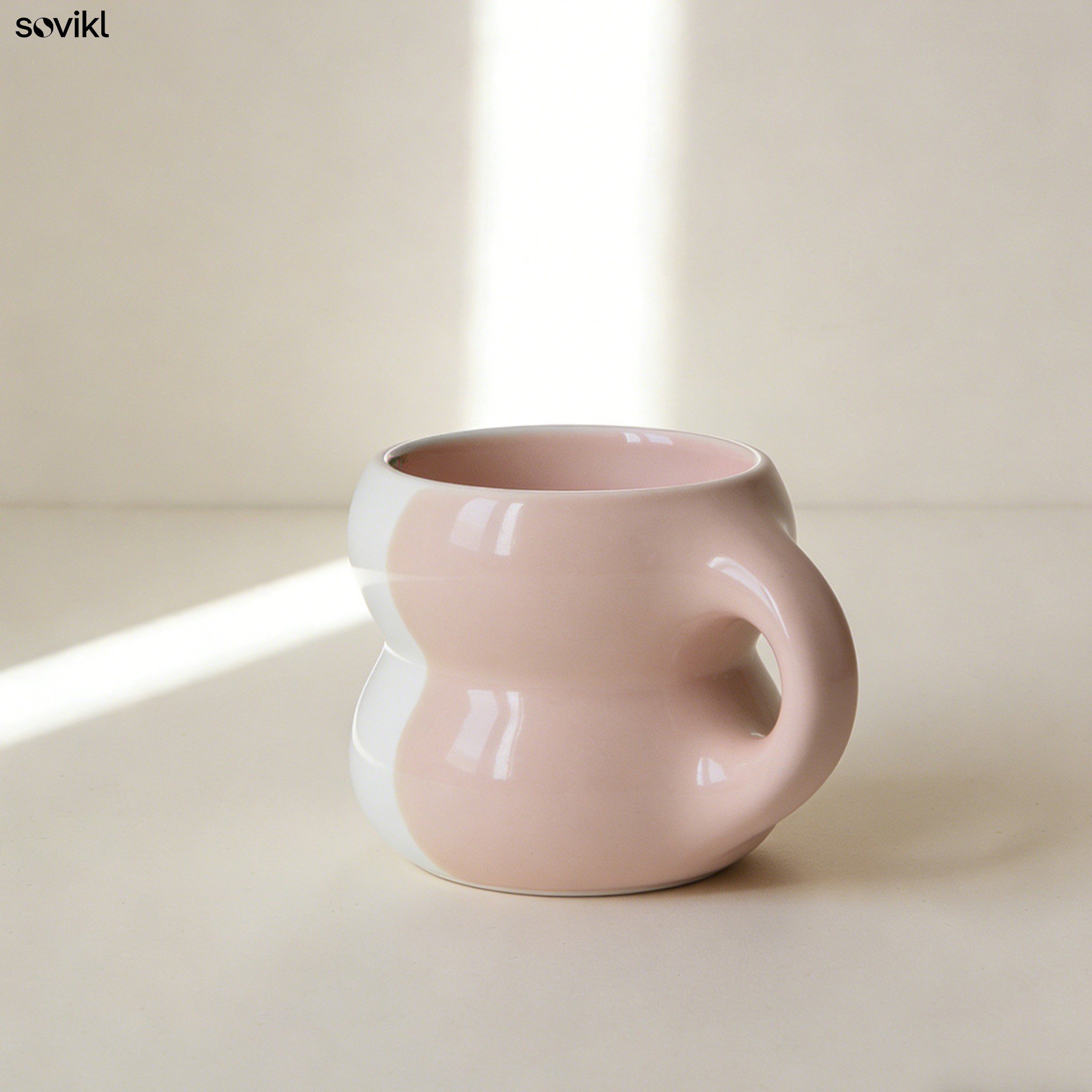 Close-up of colorful ceramic mugs with wave design