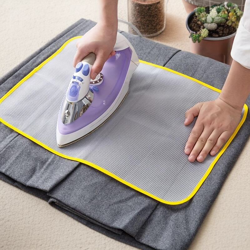 Ironing board with heat resistant cloth guard protector