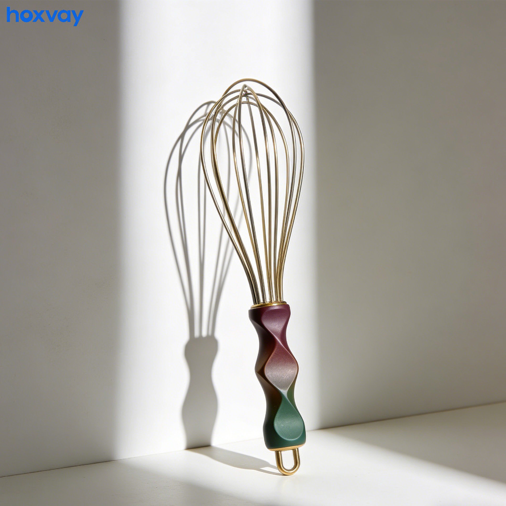 Manual egg beaters mixing eggs in a glass bowl
