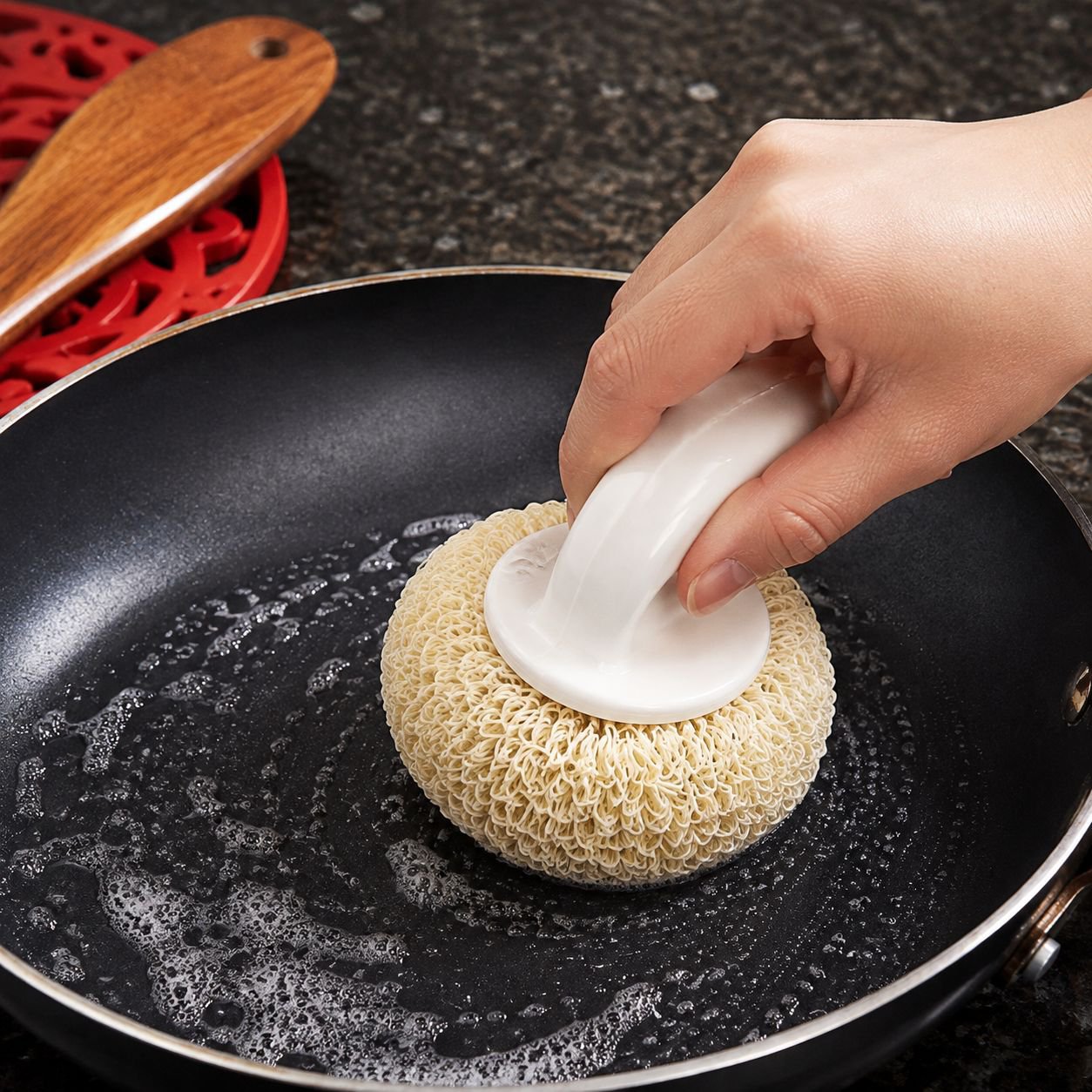 Scrubbing ball that won't damage pots or hands, a kitchen scrubber and dishwashing tool with a handl