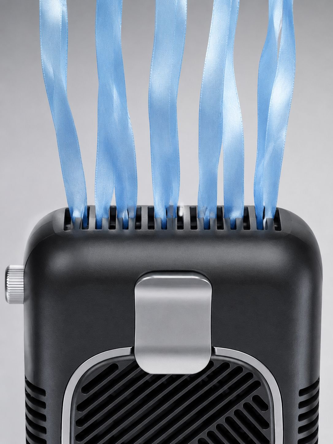 Portable waist-mounted fan clipped to a belt for hands-free cooling