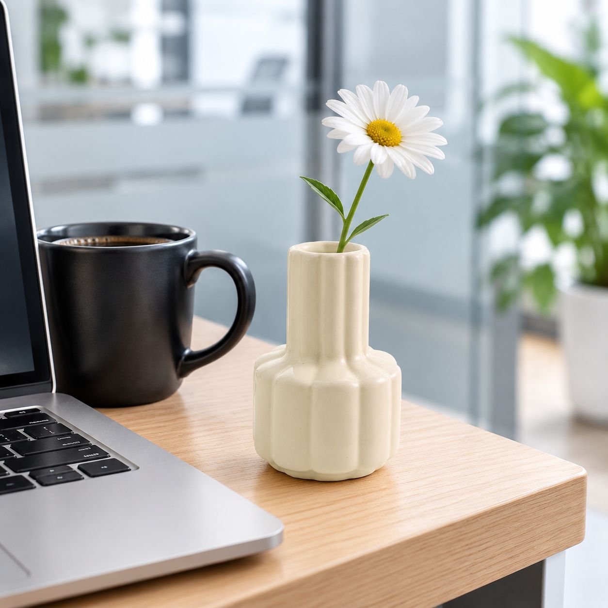 Elegant artificial flower arrangement in small ceramic vase