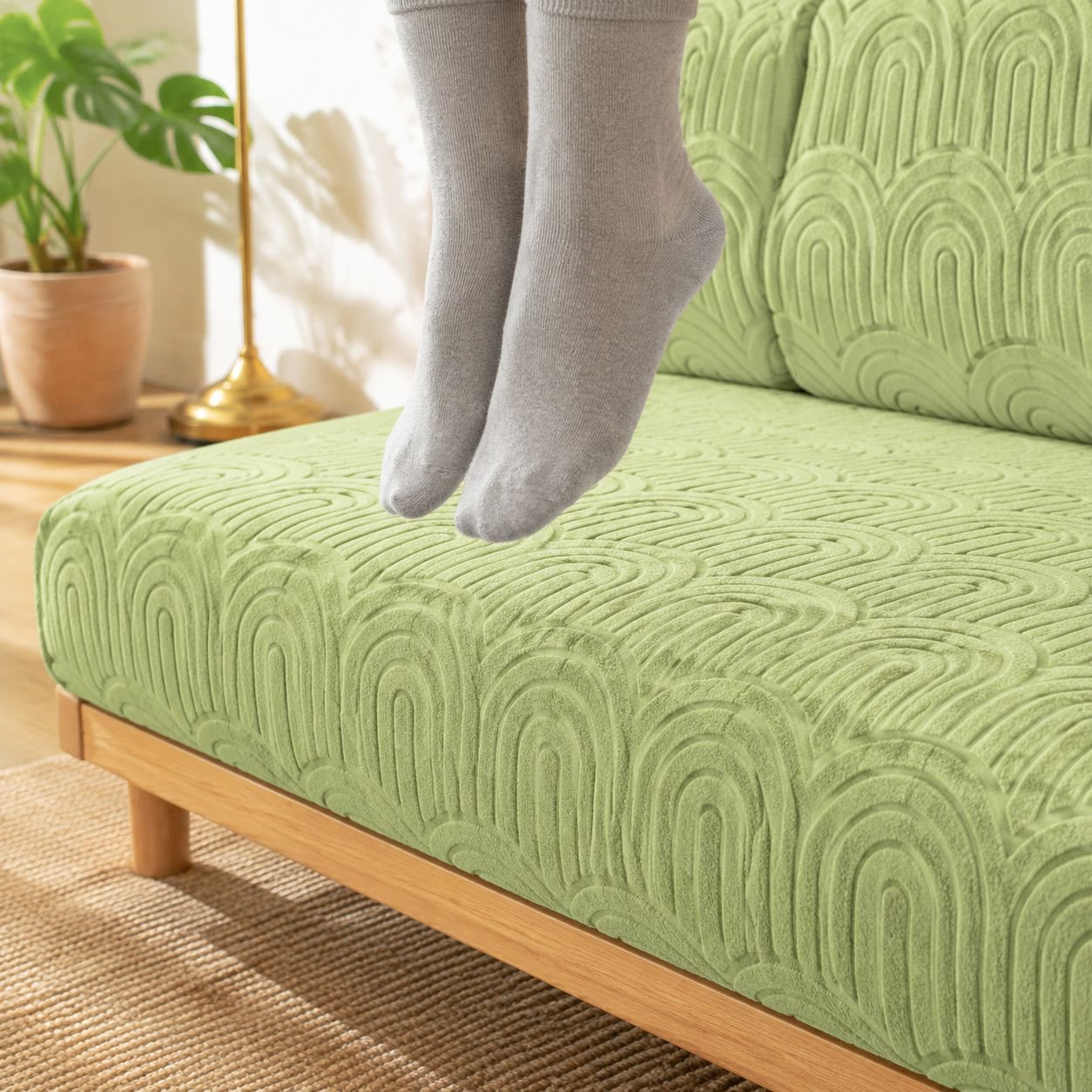 Stretchable sofa cover fitting perfectly onto a three-seater couch