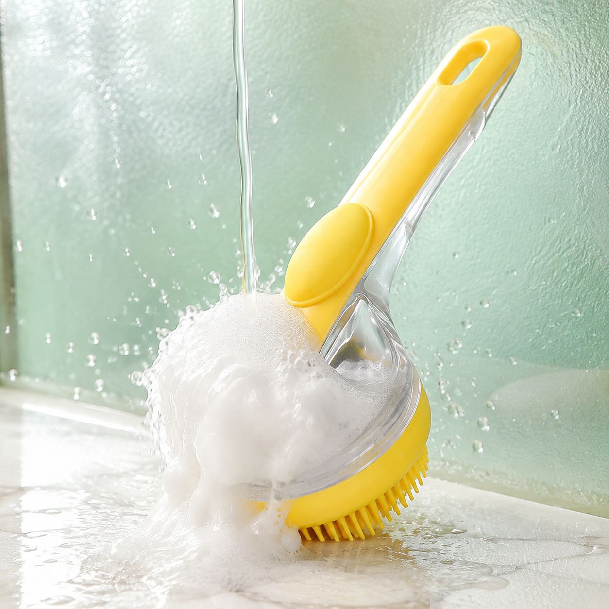 Pet shower brush with push out shampoo feature