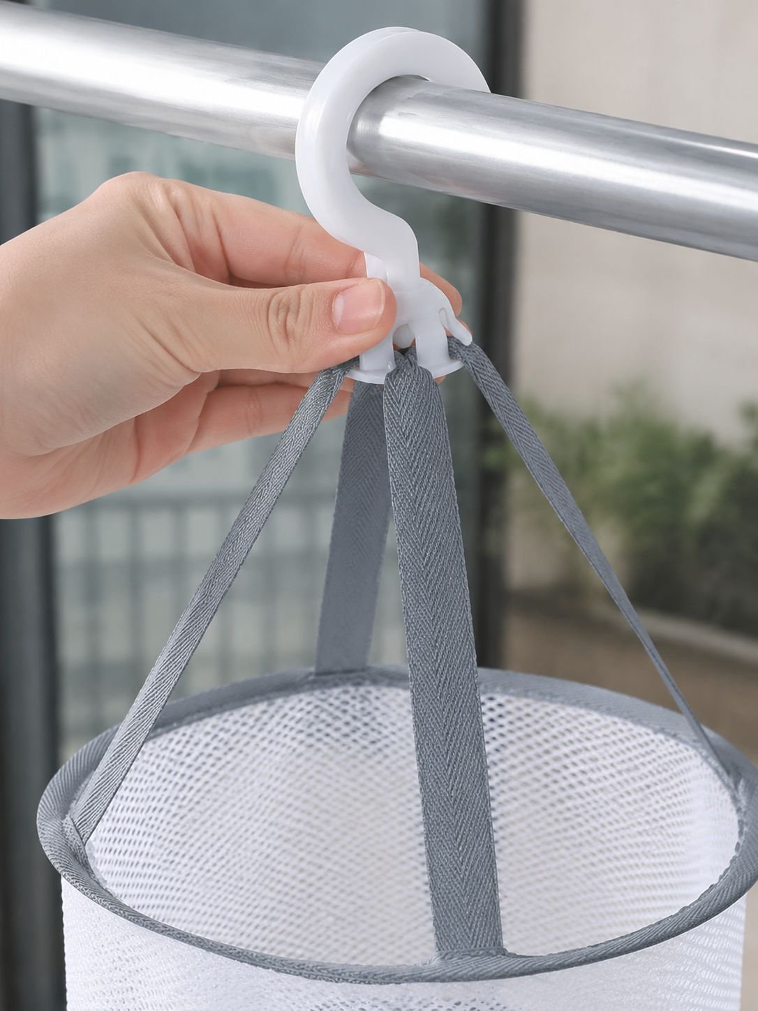 Foldable clothes drying basket with clothes inside