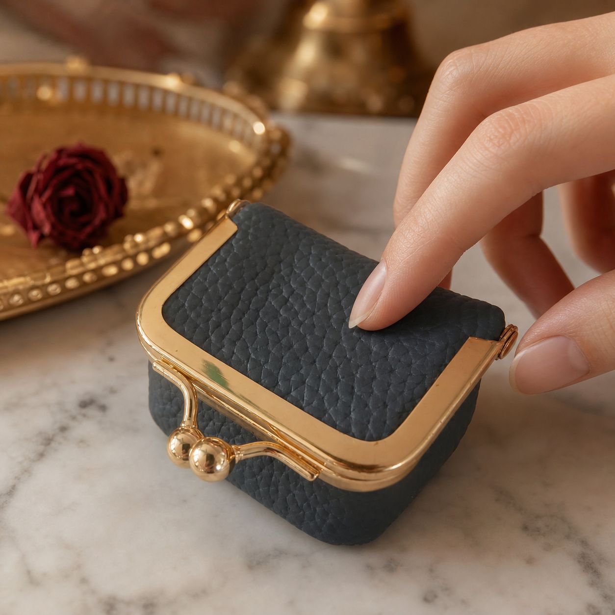 Mini jewelry case for women holding gold rings and earrings