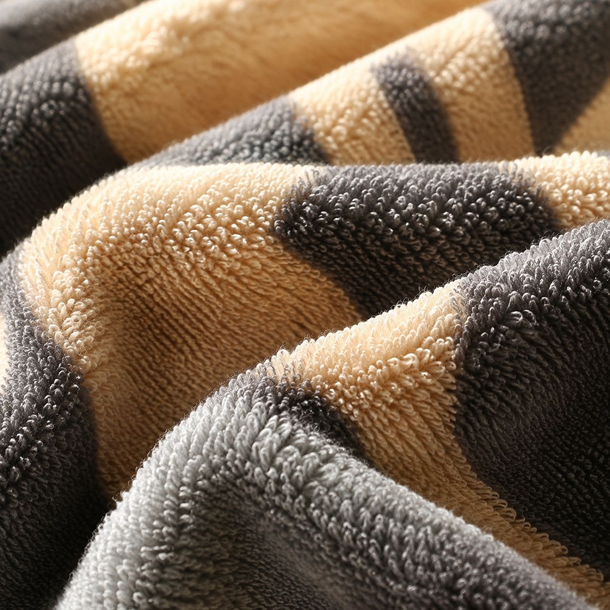 Absorbent pure cotton towel displayed on a bathroom rack