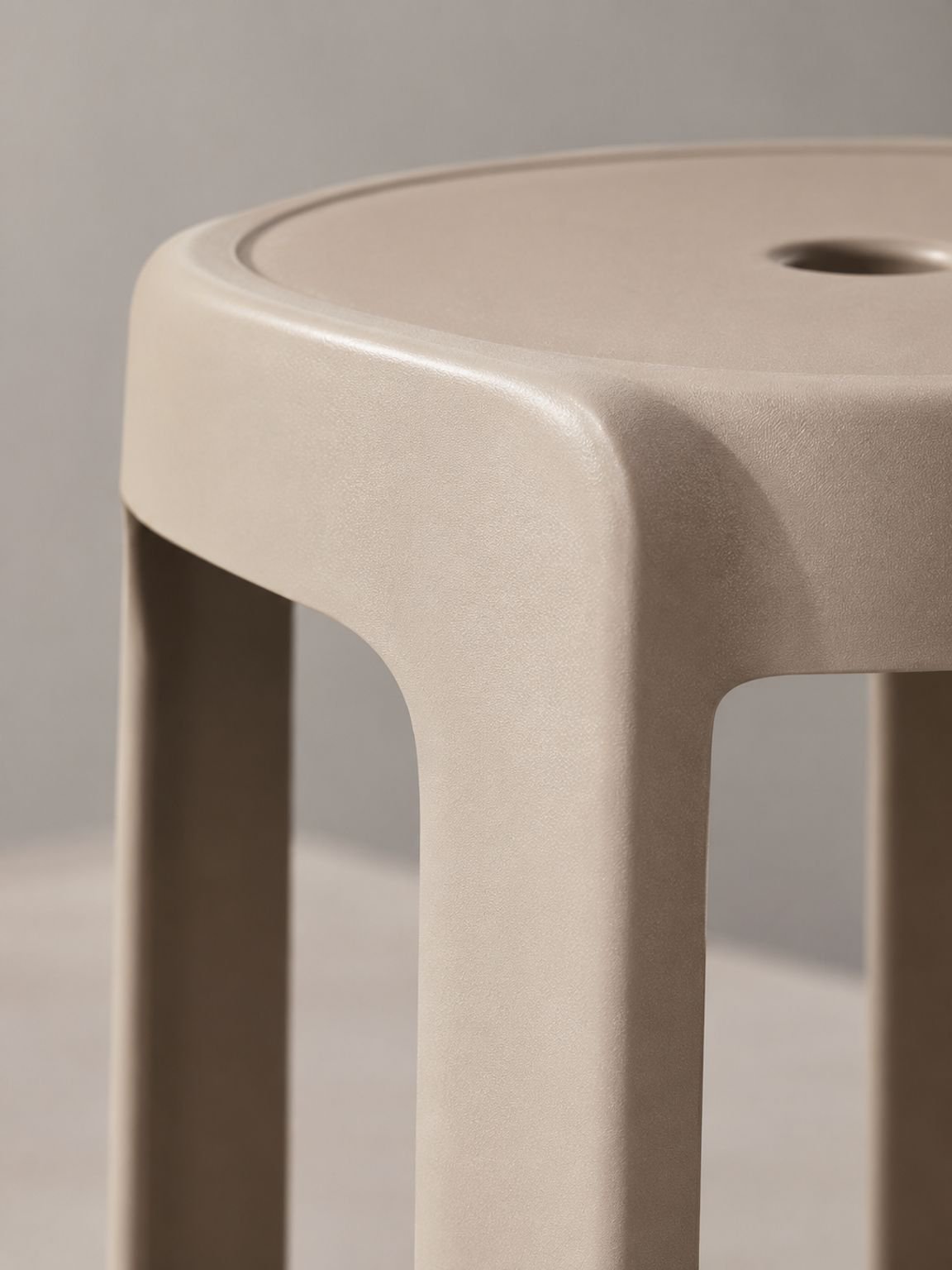 Lightweight plastic stool used as extra seating in a living room