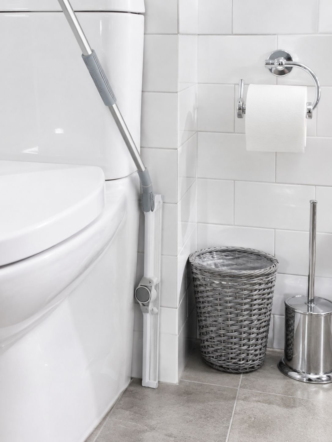 Home bathroom squeegee removing water from tiles