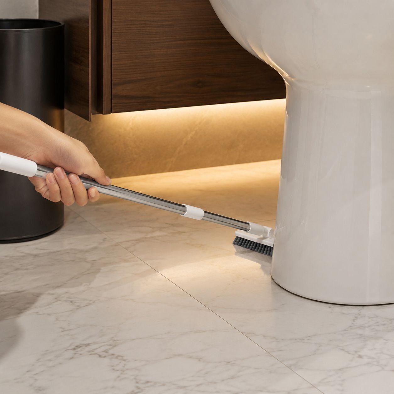 Stiff bristles removing grime from tile grout