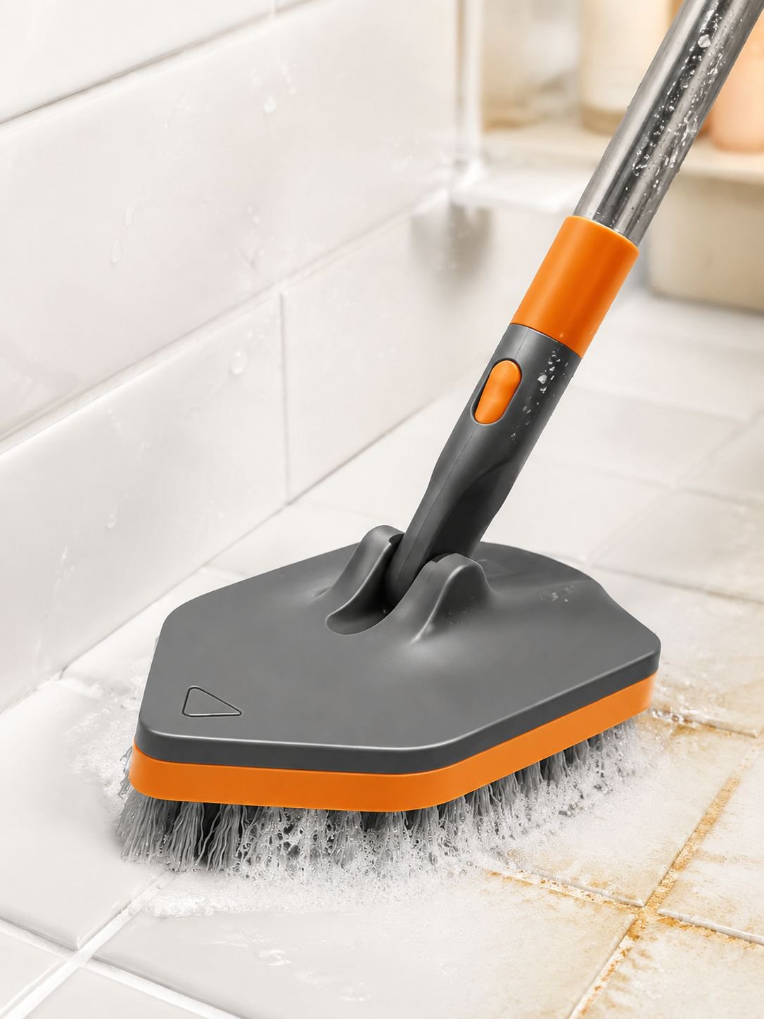 Cleaning brush scrubbing bathroom tiles