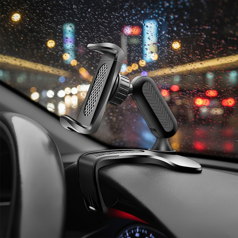 Car dashboard clip-on phone holder mounted on dashboard