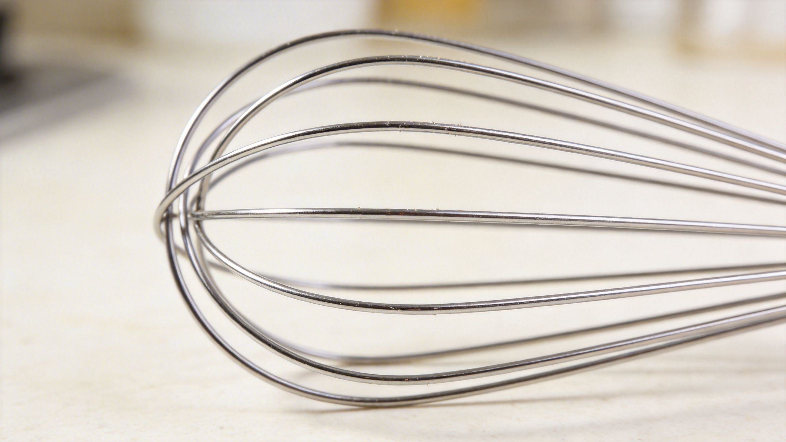 Homemade butter being made with stainless steel whipper