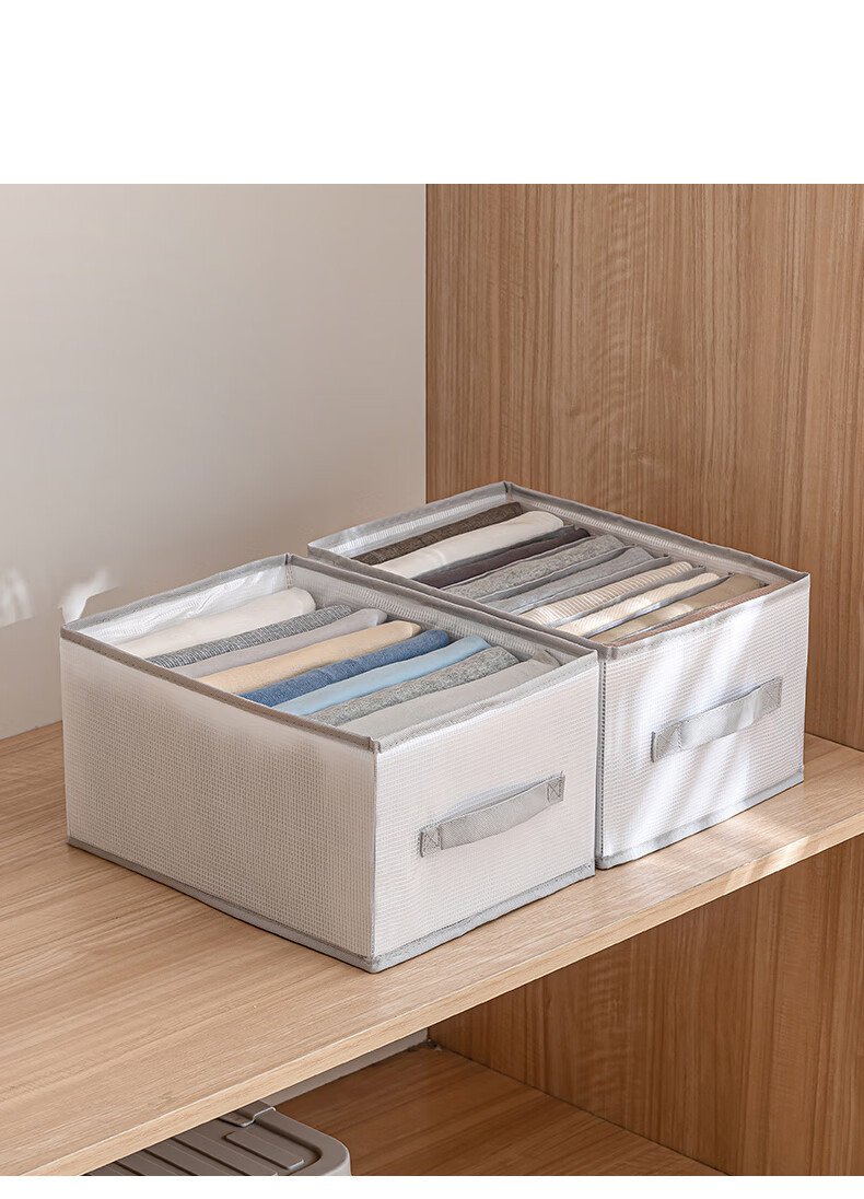 Divided storage organiser arranged inside a bedroom drawer