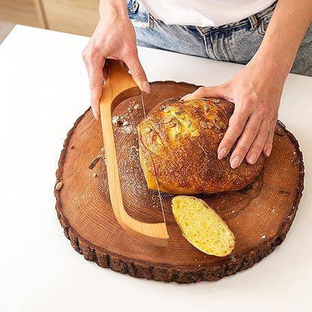 Rustic wooden bread knife in modern kitchen
