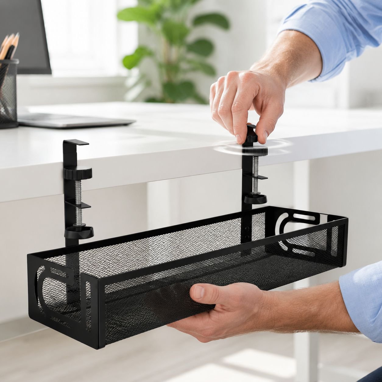 Power strip holder attached under desk for tidy cables