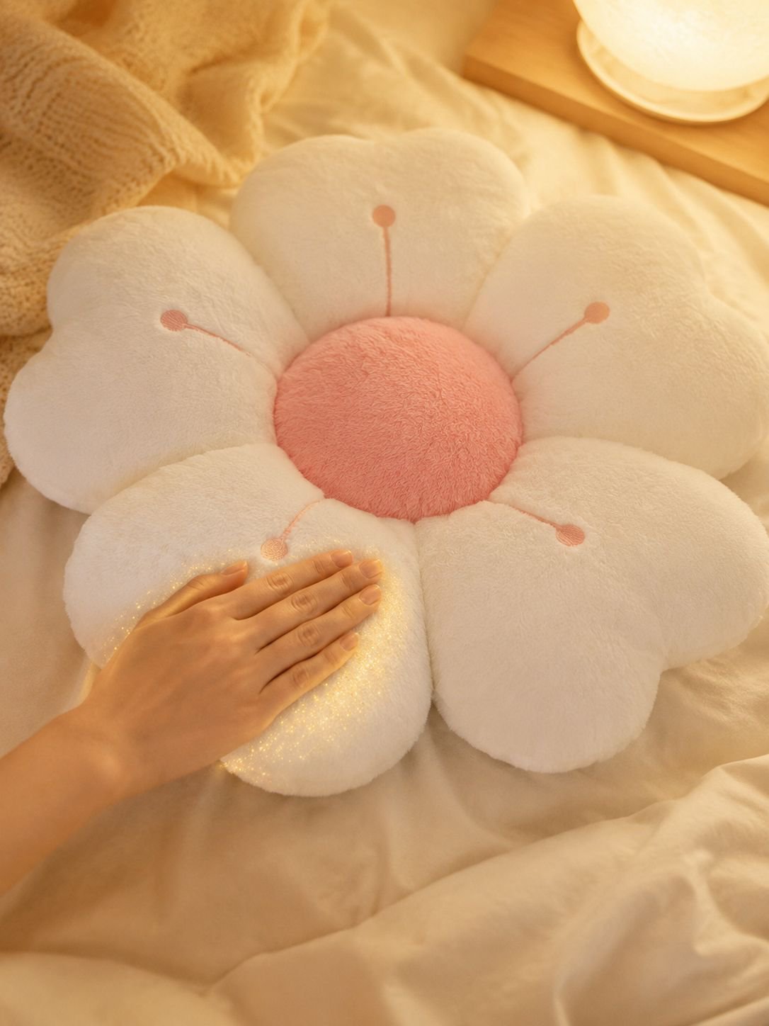 Cute plush cushion on bed