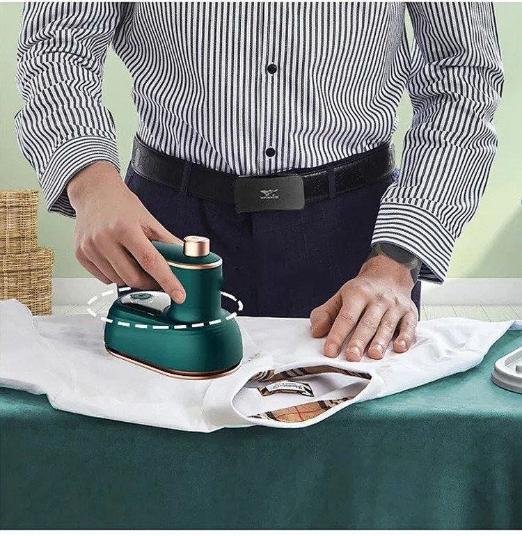 Handheld steam ironing machine